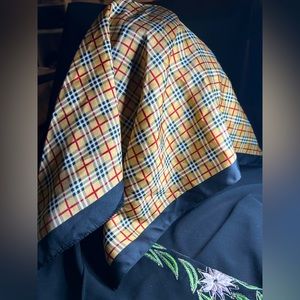 Unbranded Polyester Plaid scarf, one edge is fraying.